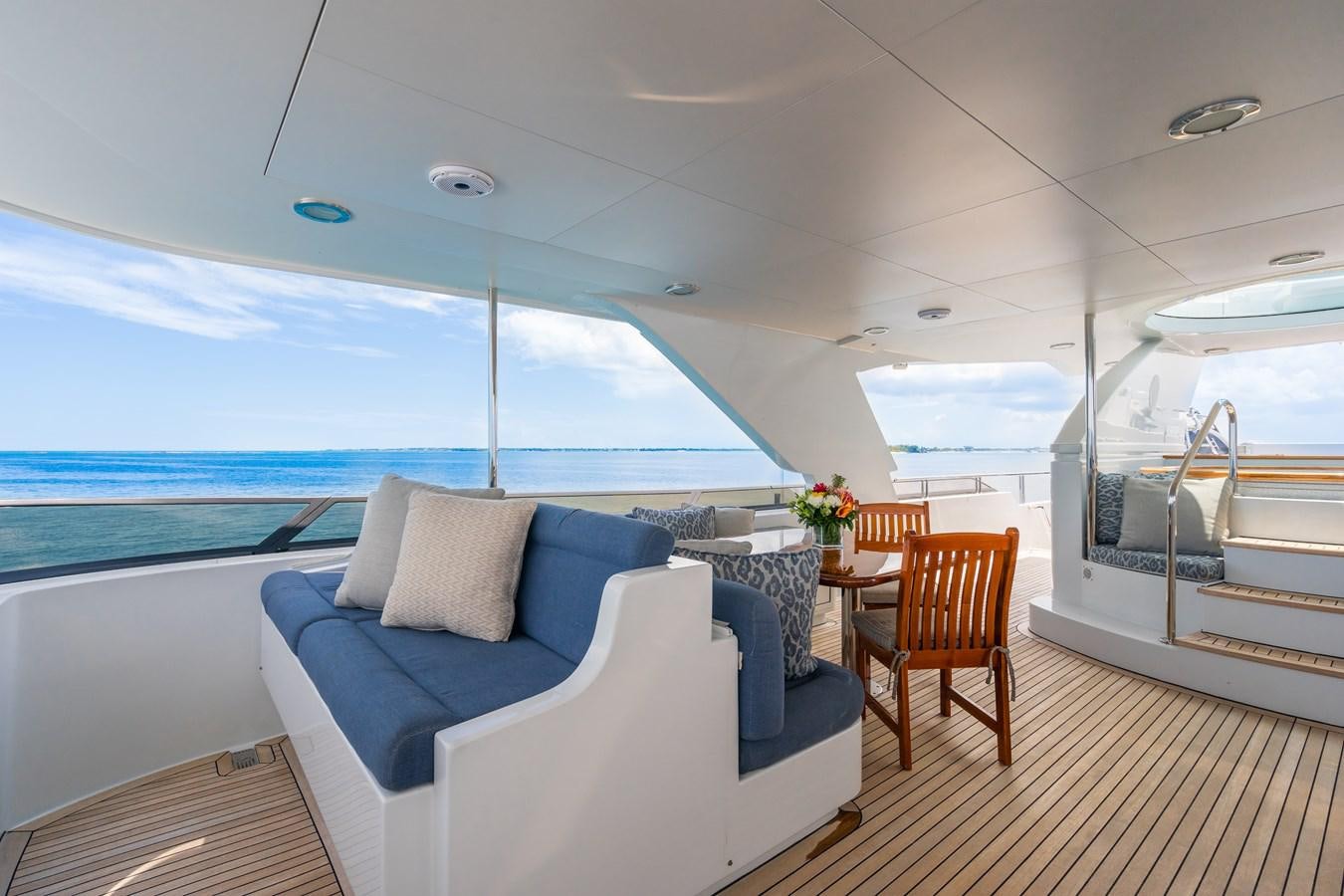 a room with a couch and a table and chairs aboard MISS STEPHANIE Yacht for Sale