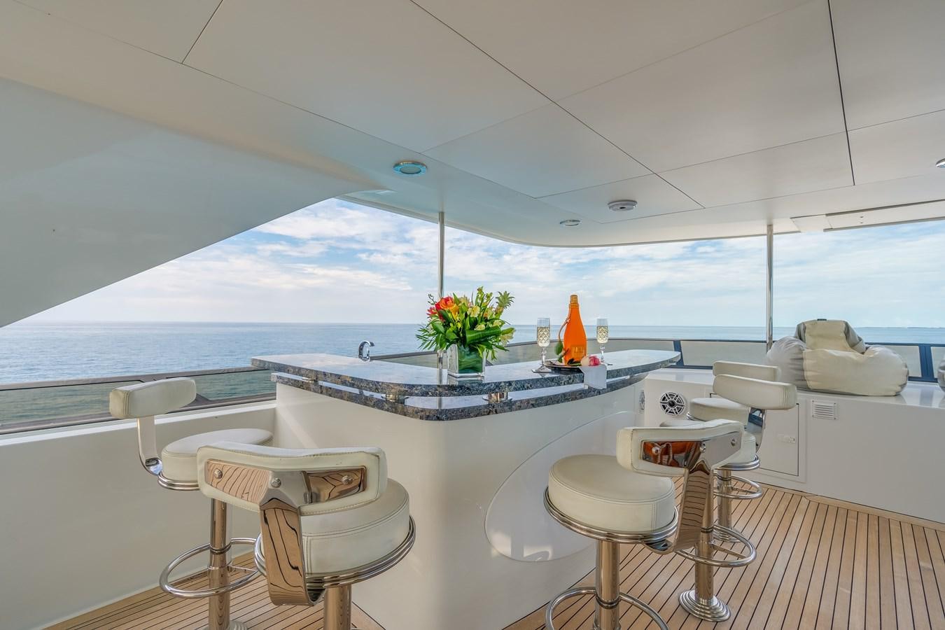 a room with a table and chairs aboard MISS STEPHANIE Yacht for Sale