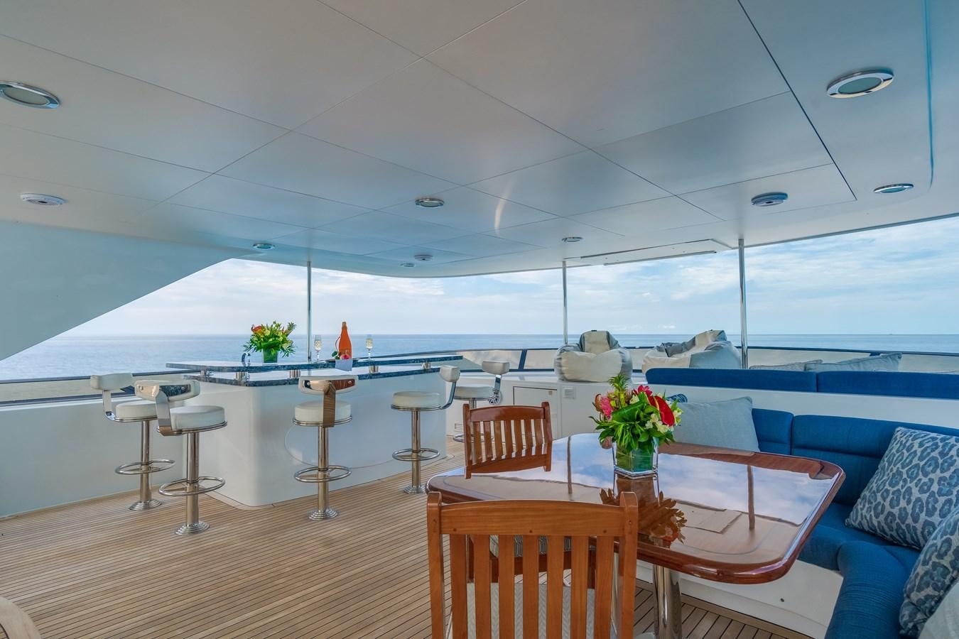 a room with a table and chairs aboard MISS STEPHANIE Yacht for Sale