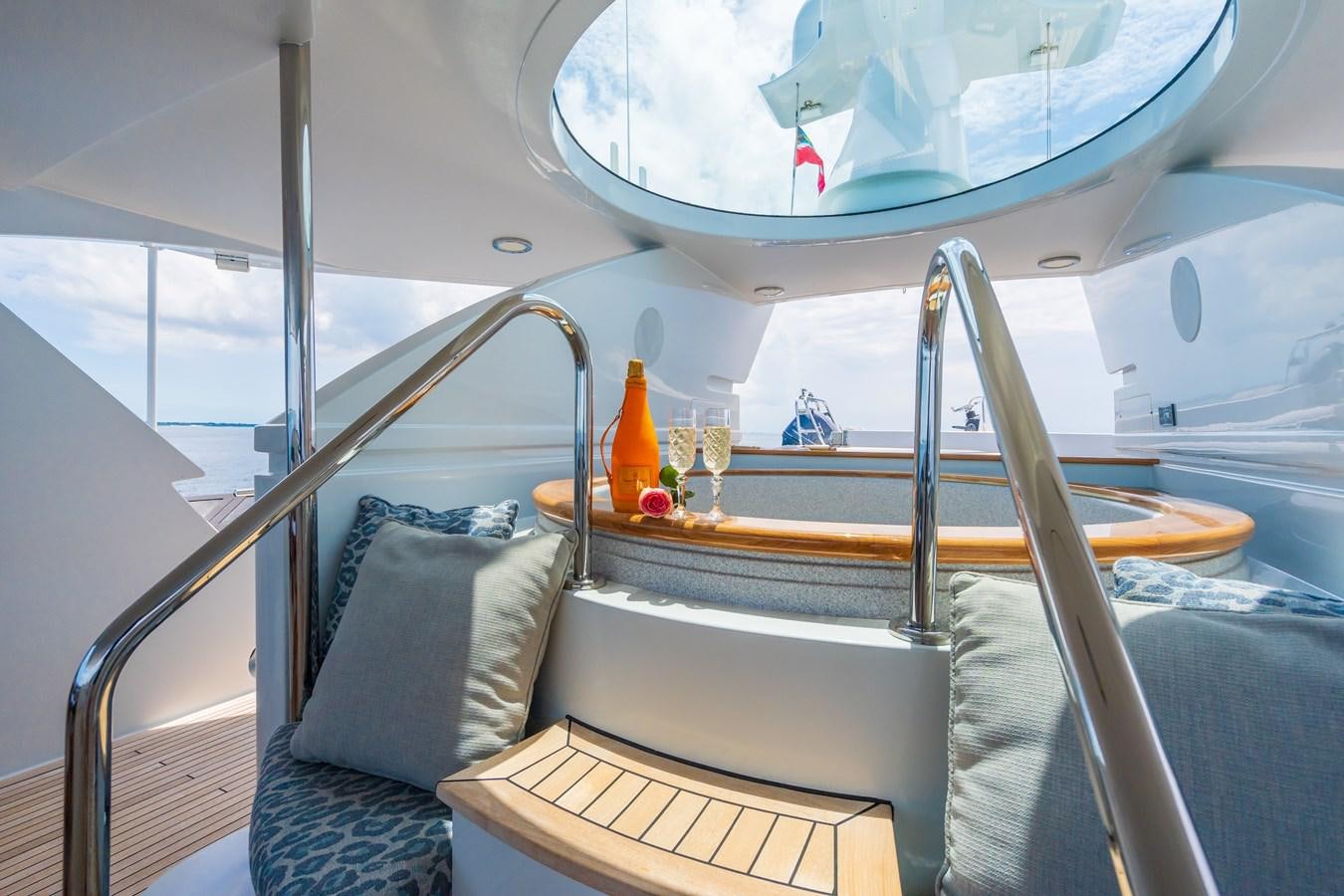 a boat with a bed and a table on it aboard MISS STEPHANIE Yacht for Sale
