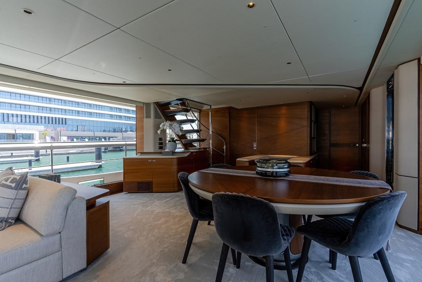 a room with a table and chairs aboard 2022 PRINCESS X95 Yacht for Sale