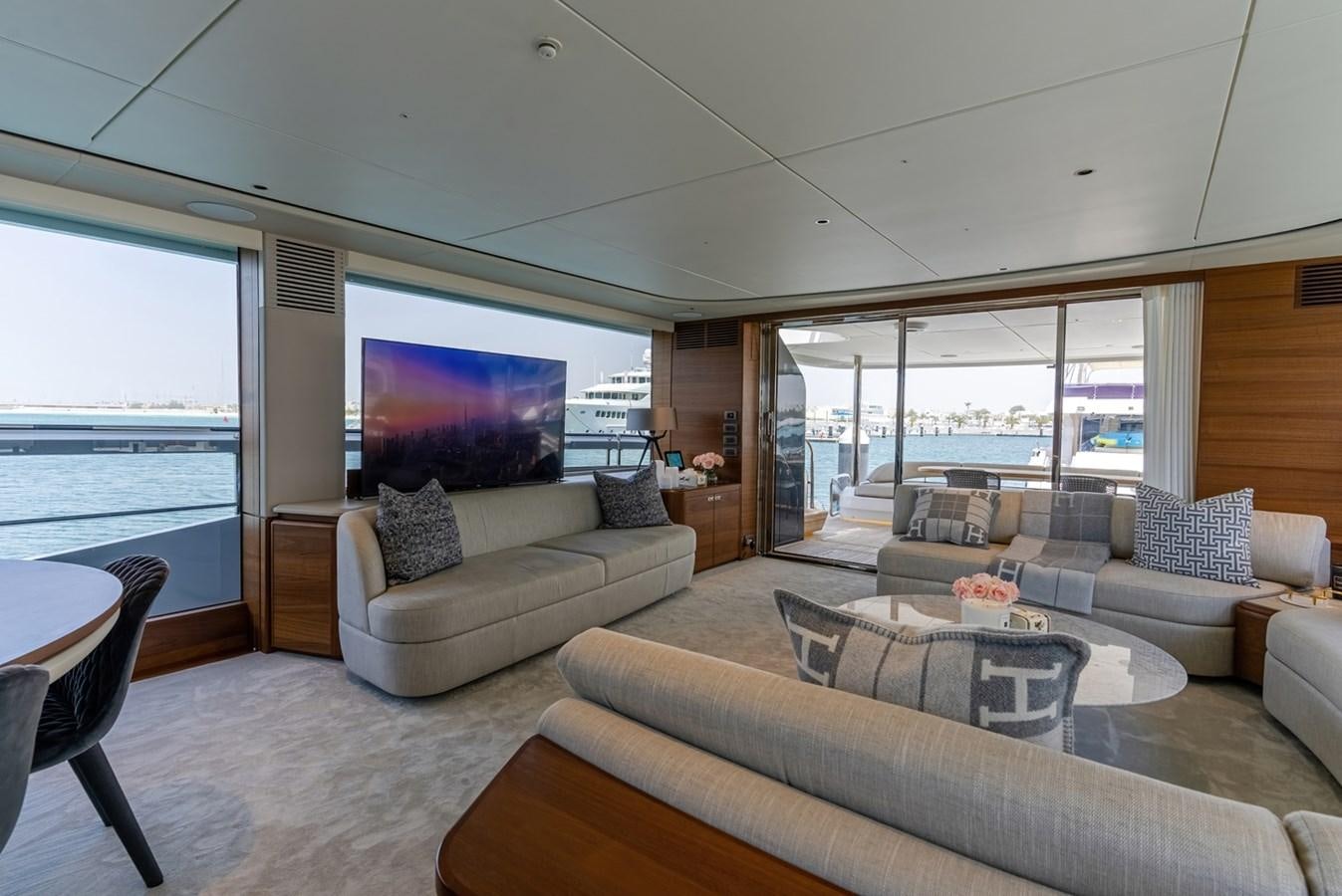 a living room with a large window aboard 2022 PRINCESS X95 Yacht for Sale