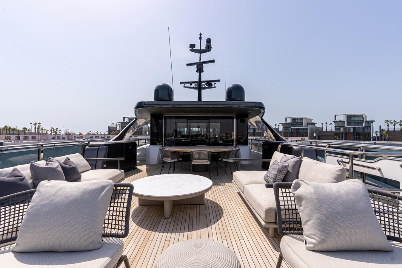 a living room with a fireplace aboard 2022 PRINCESS X95 Yacht for Sale