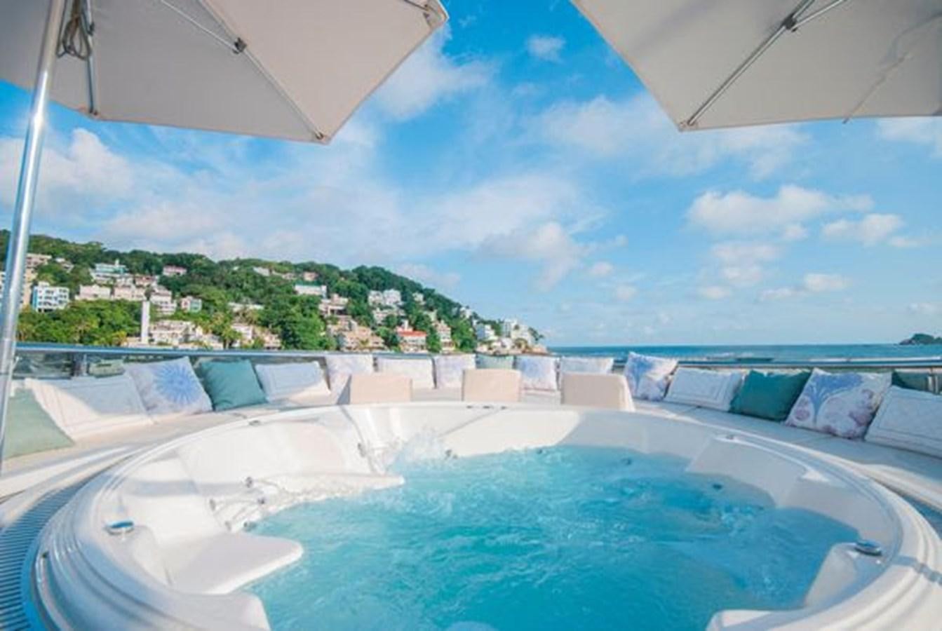 a pool with a building in the background aboard 2024 MCP MY 140 Yacht for Sale