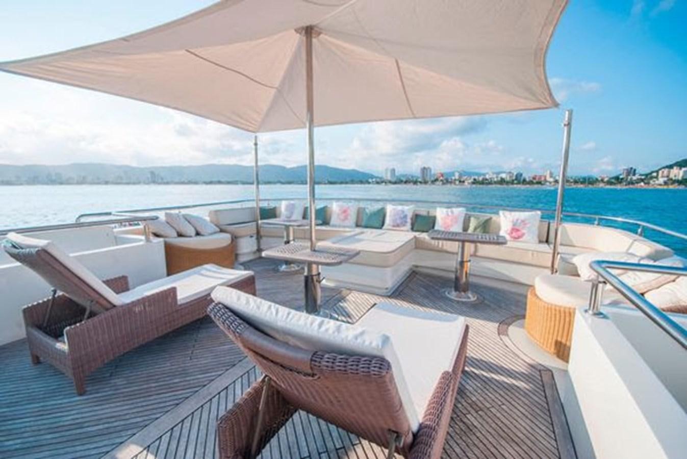 a lounge area with chairs and umbrellas aboard 2024 MCP MY 140 Yacht for Sale
