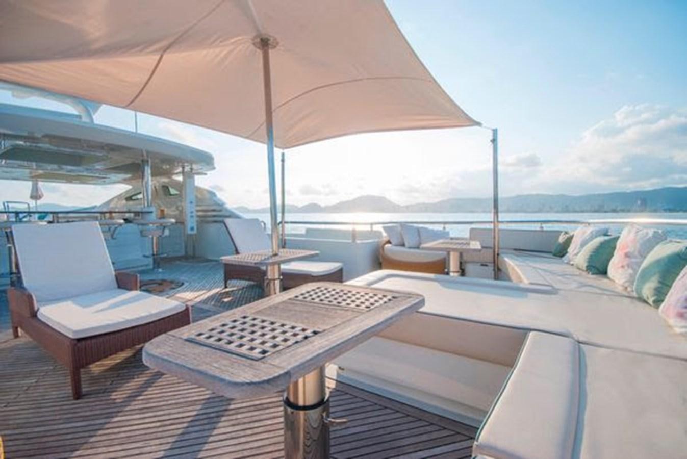 a lounge area with a table and chairs on it aboard 2024 MCP MY 140 Yacht for Sale