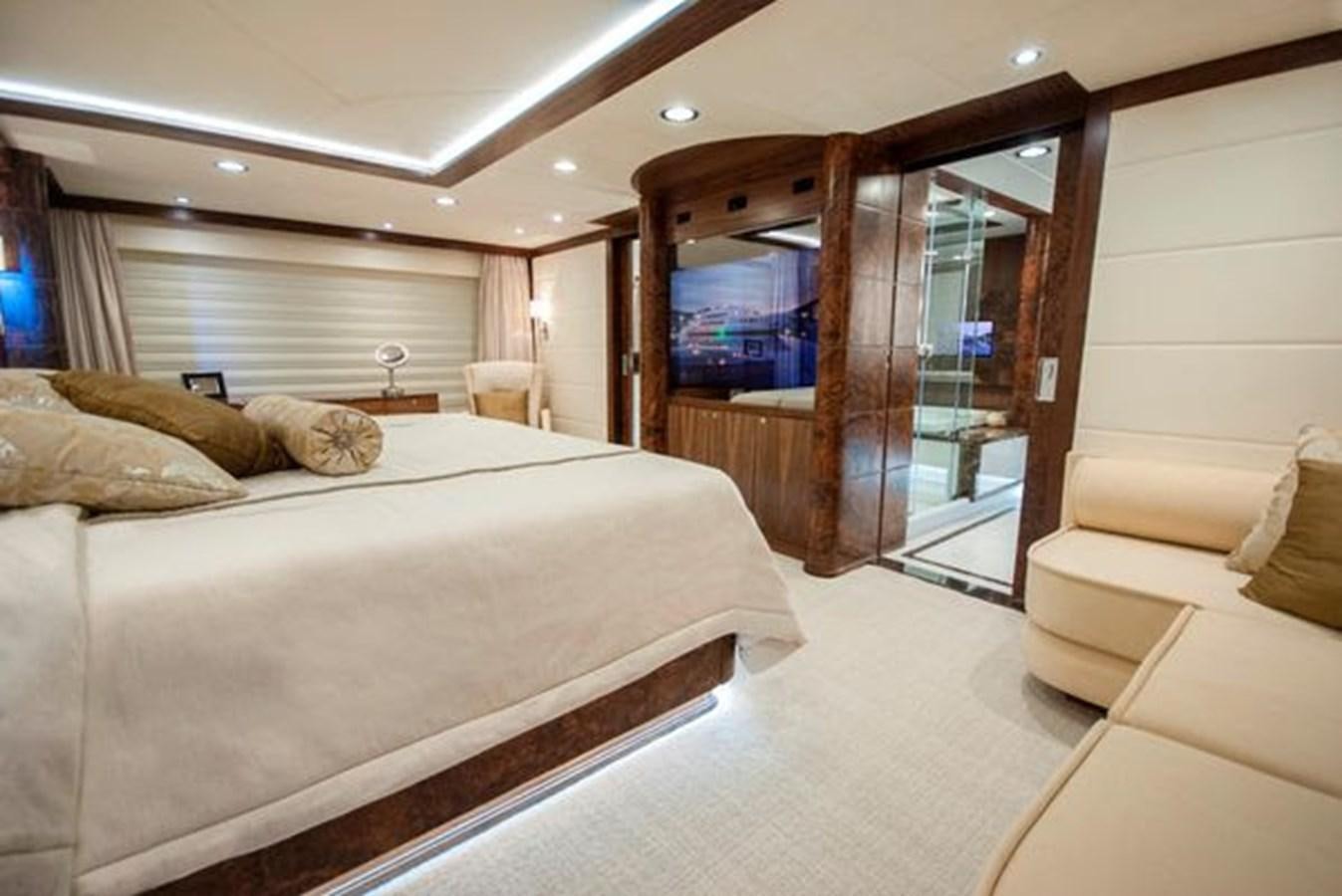 a room with a bed and a mirror aboard 2024 MCP MY 140 Yacht for Sale
