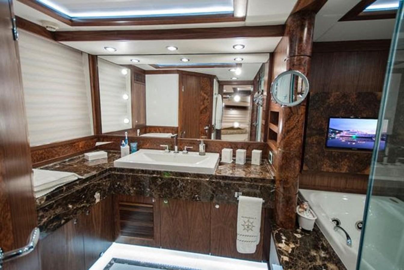 a bathroom with a large mirror aboard 2024 MCP MY 140 Yacht for Sale