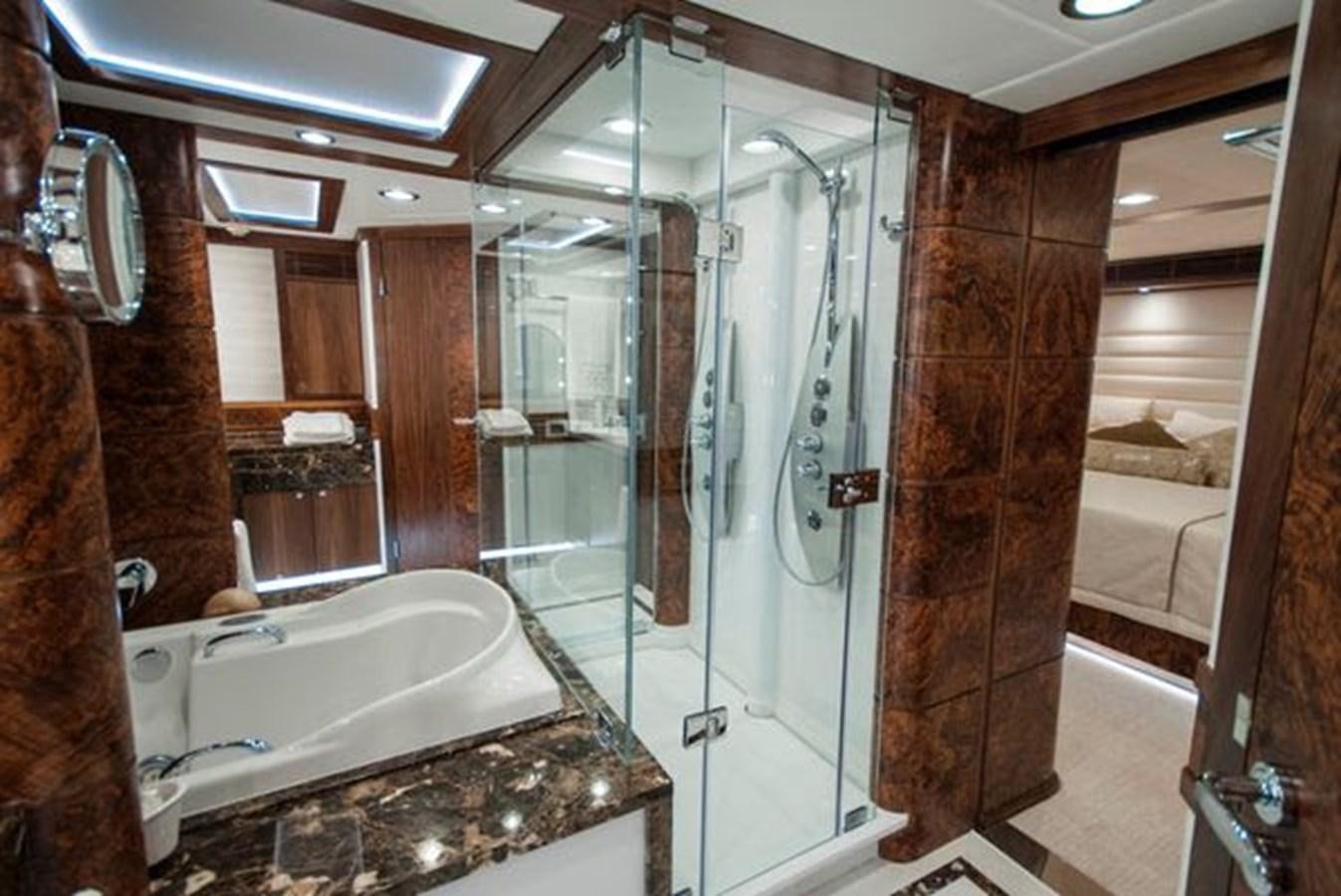a bathroom with a glass shower aboard 2024 MCP MY 140 Yacht for Sale