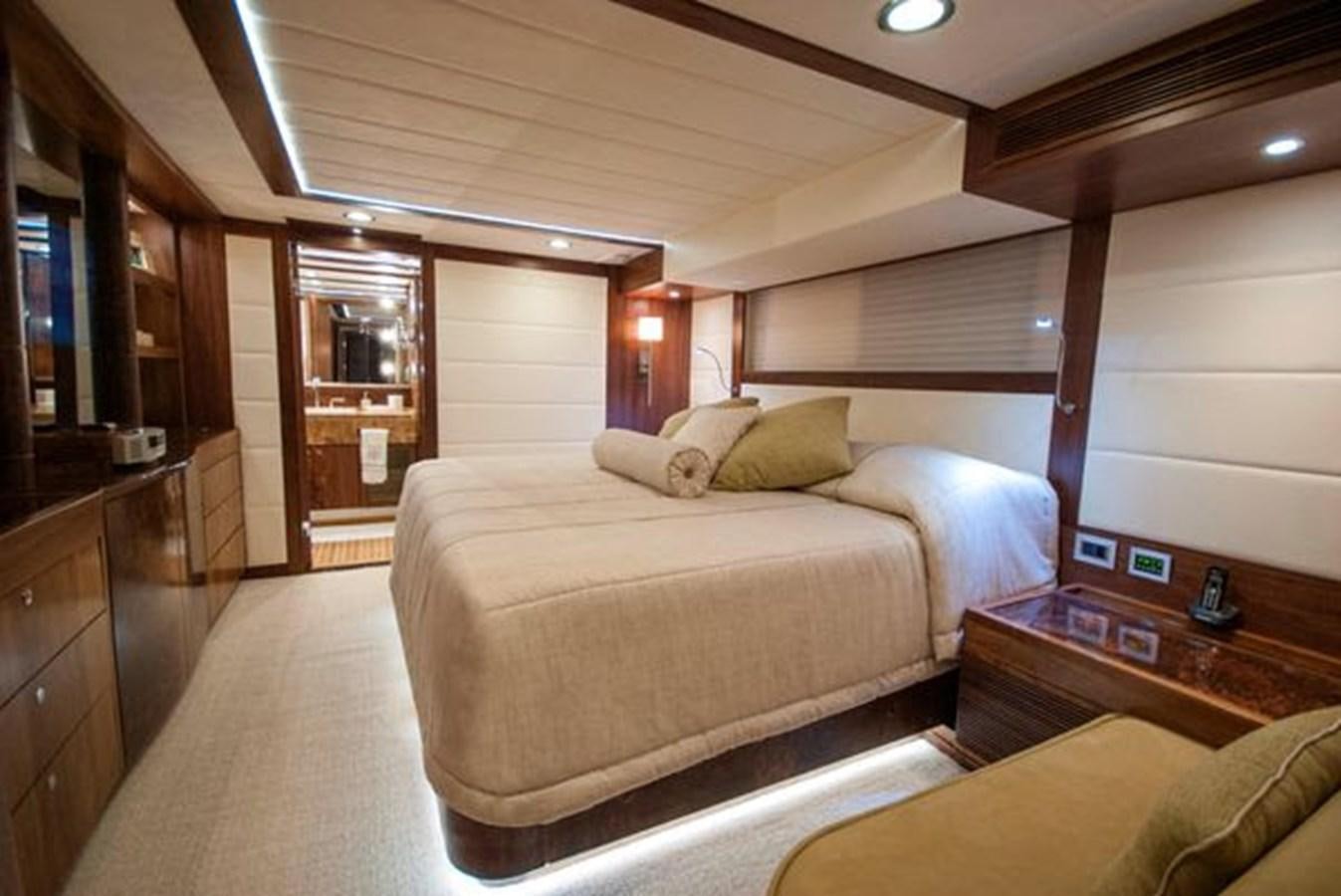 a bedroom with a bed and a wood floor aboard 2024 MCP MY 140 Yacht for Sale