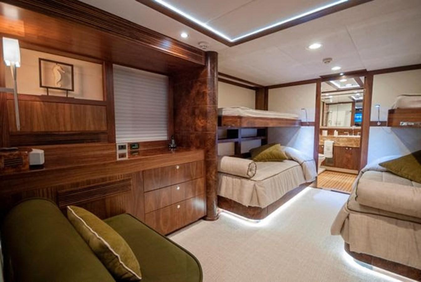 a bedroom with a bed and a couch aboard 2024 MCP MY 140 Yacht for Sale