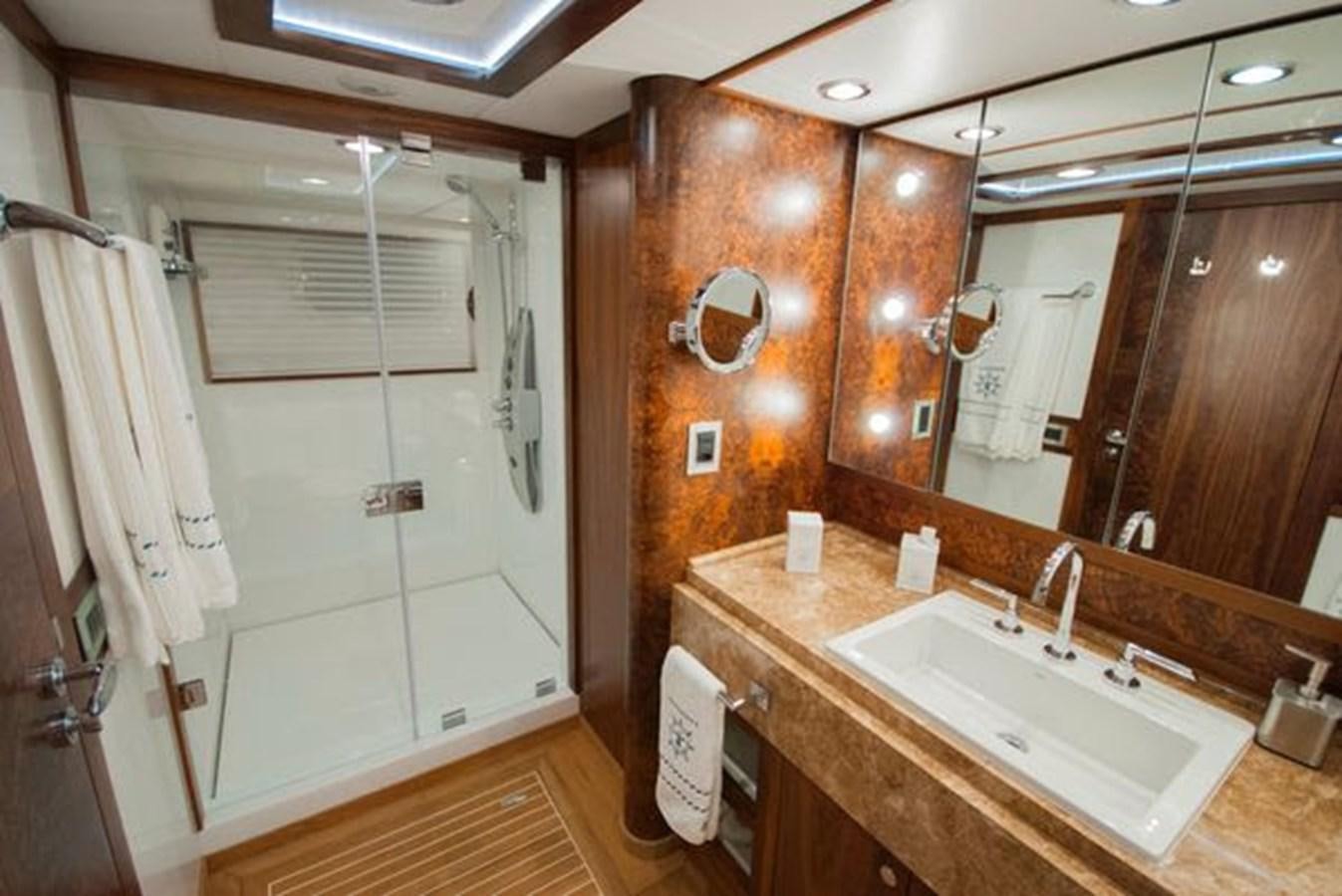 a bathroom with a sink and a mirror aboard 2024 MCP MY 140 Yacht for Sale