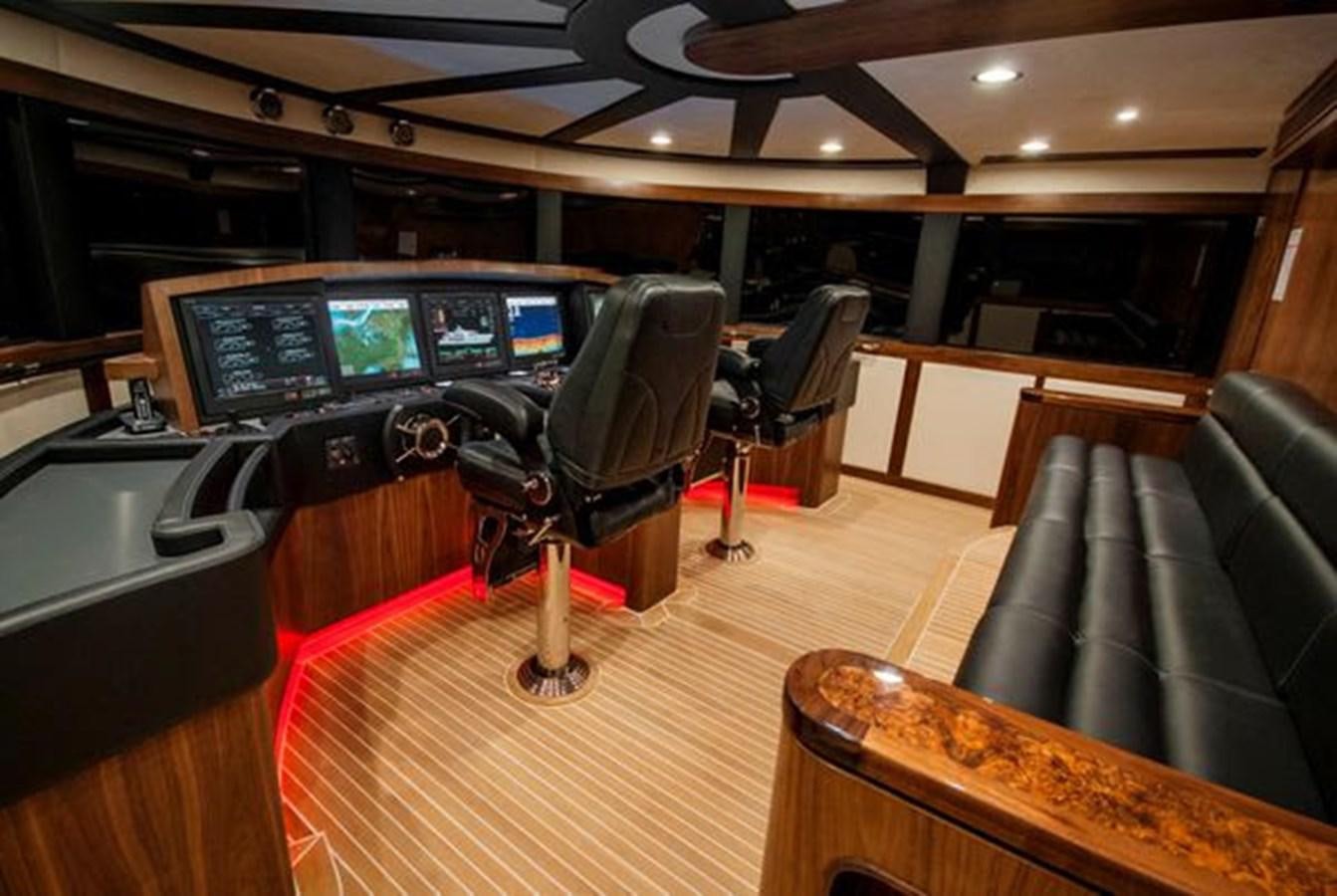 a room with a desk and chairs aboard 2024 MCP MY 140 Yacht for Sale