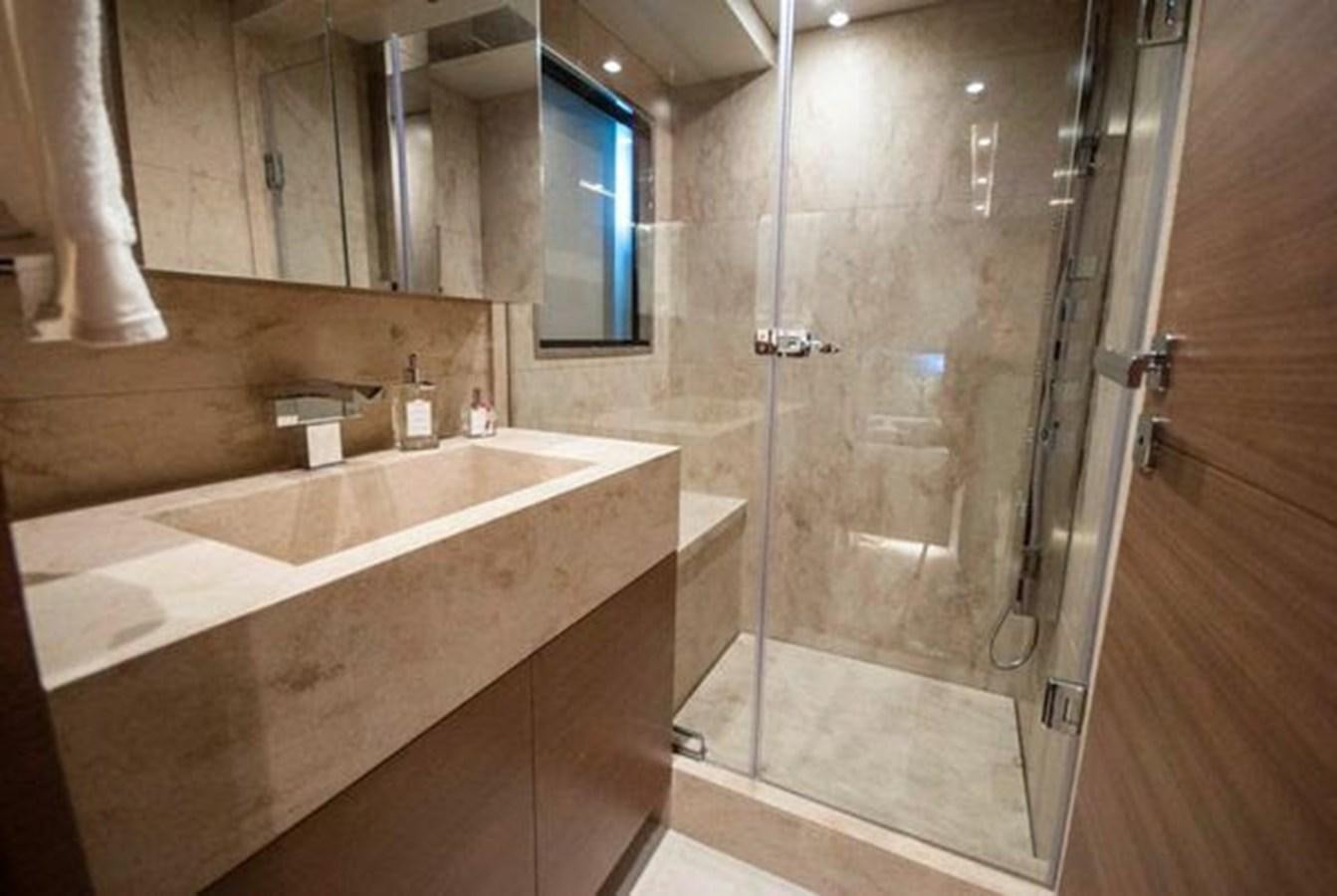 a bathroom with a glass shower aboard 2024 MCP 106 LE Yacht for Sale