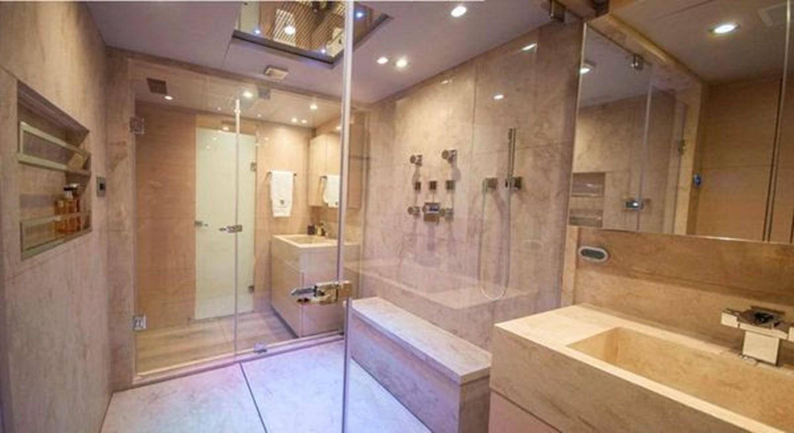a bathroom with a large shower aboard 2024 MCP 106 LE Yacht for Sale