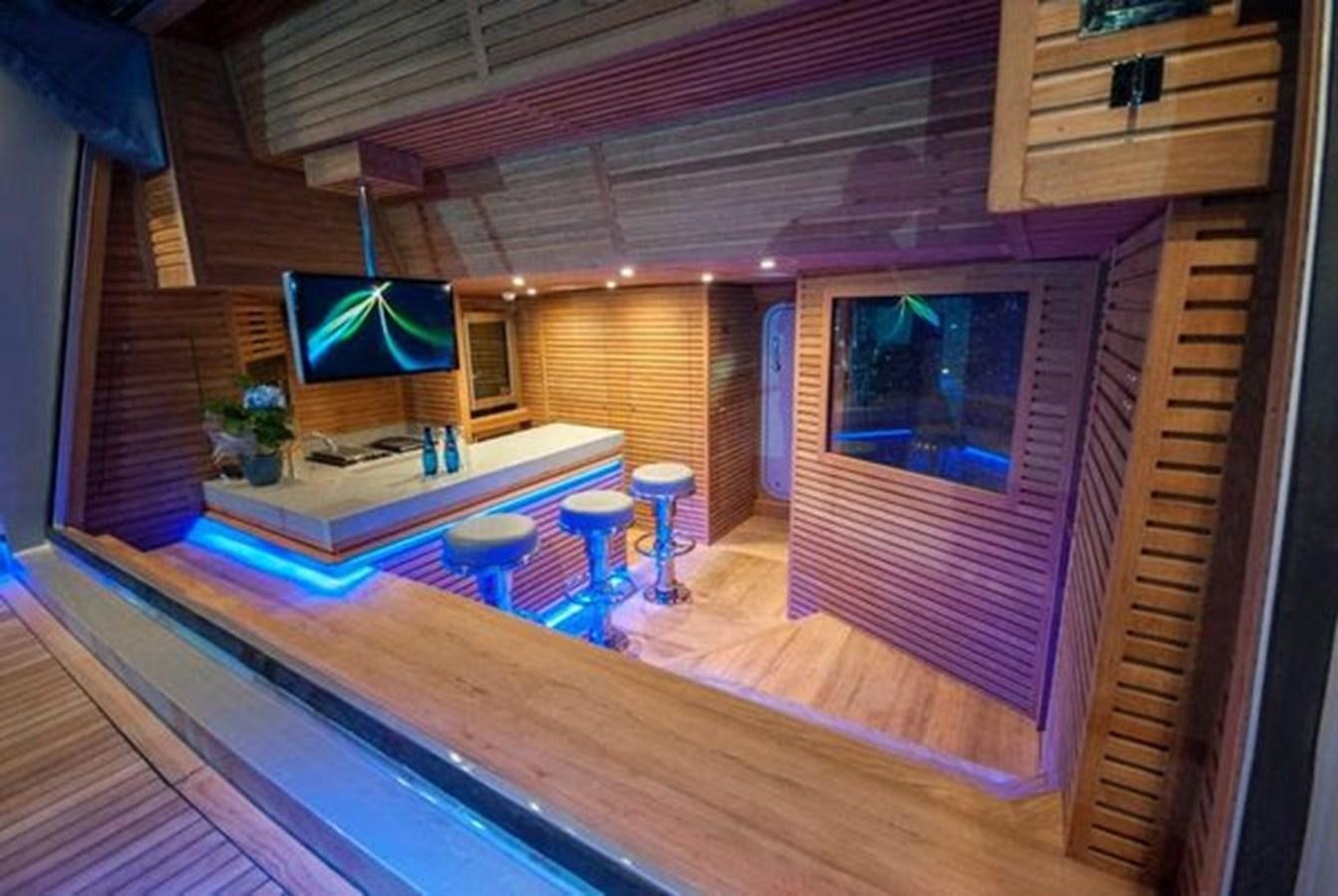 a room with a television and a table aboard 2024 MCP 106 LE Yacht for Sale