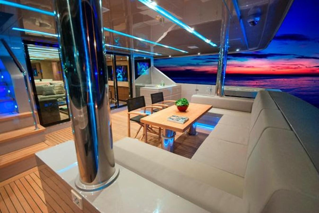 a room with a table and chairs aboard 2024 MCP 106 LE Yacht for Sale