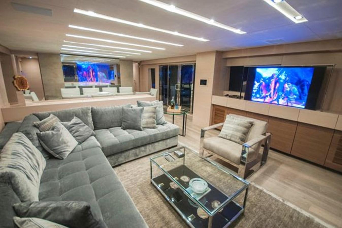 a living room with a large television aboard 2024 MCP 106 LE Yacht for Sale