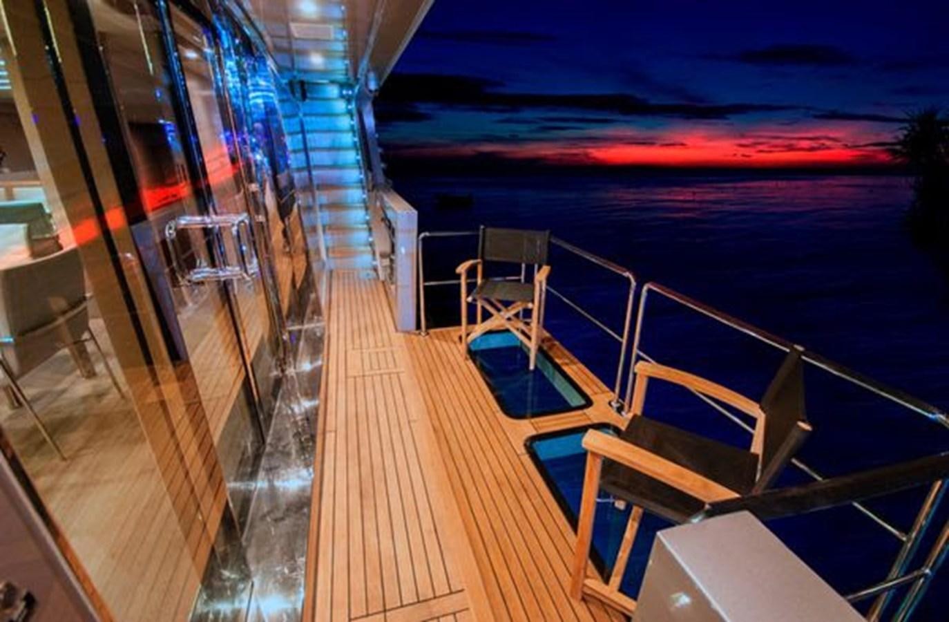 a deck with a deck and chairs aboard 2024 MCP 106 LE Yacht for Sale