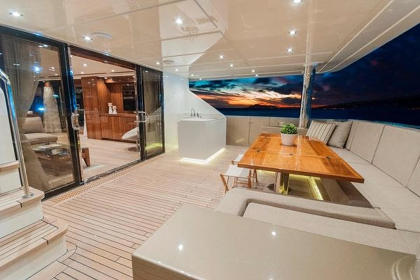 a room with a table and chairs aboard 2024 MCP 106 LE Yacht for Sale