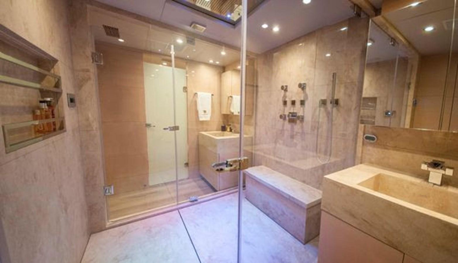 a bathroom with a tub and shower aboard 2024 MCP 106 LE Yacht for Sale