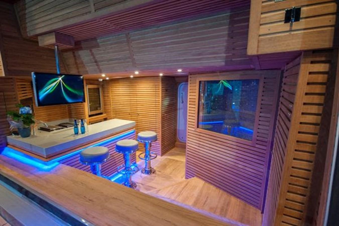 a room with a table and a tv aboard 2024 MCP 106 LE Yacht for Sale