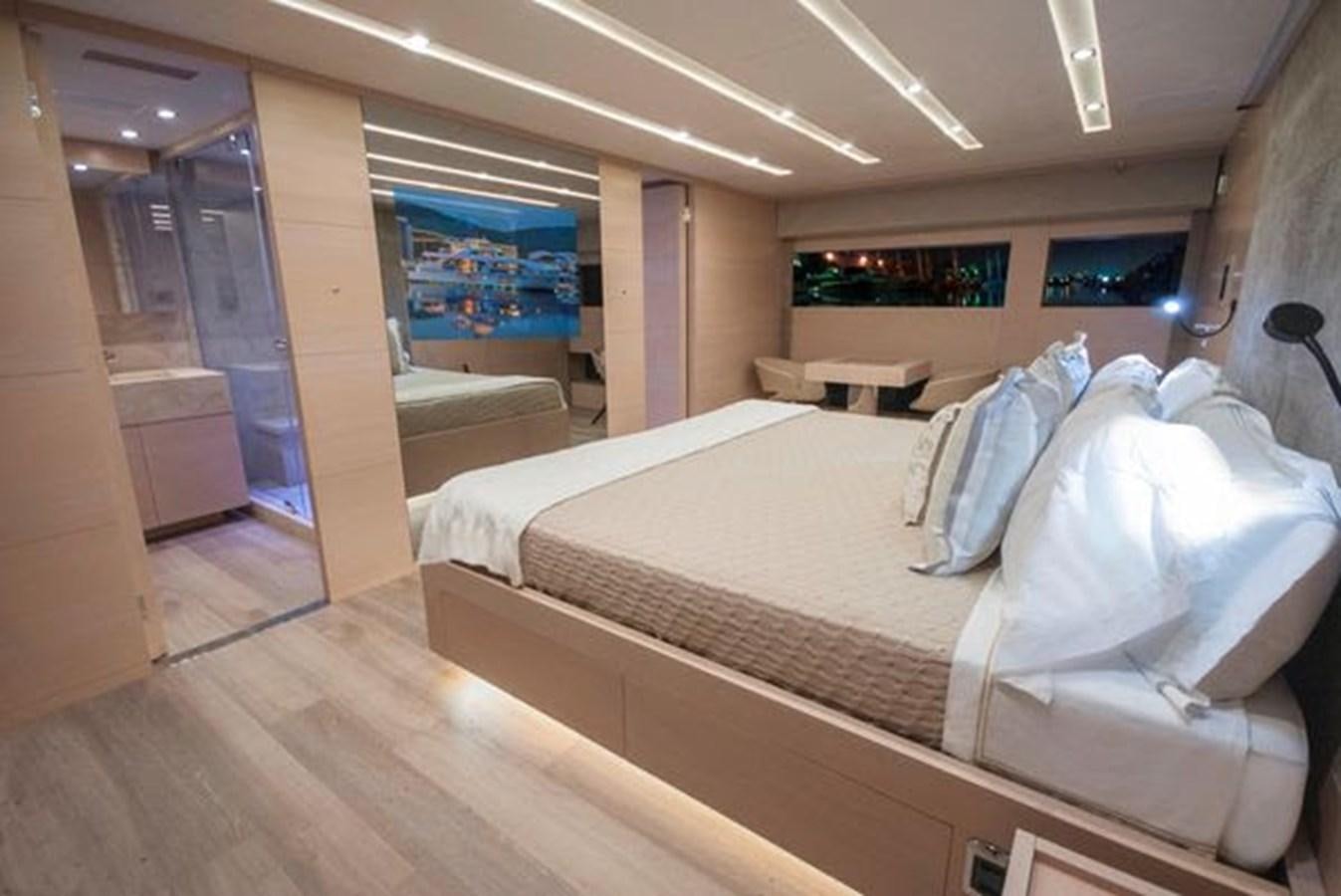a room with a bed and a television aboard 2024 MCP 106 LE Yacht for Sale