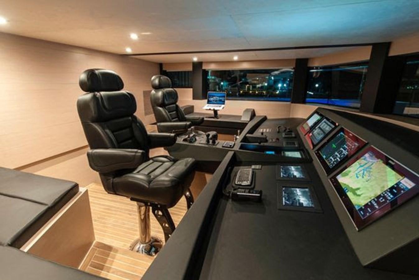 a room with a desk and chairs aboard 2024 MCP 106 LE Yacht for Sale