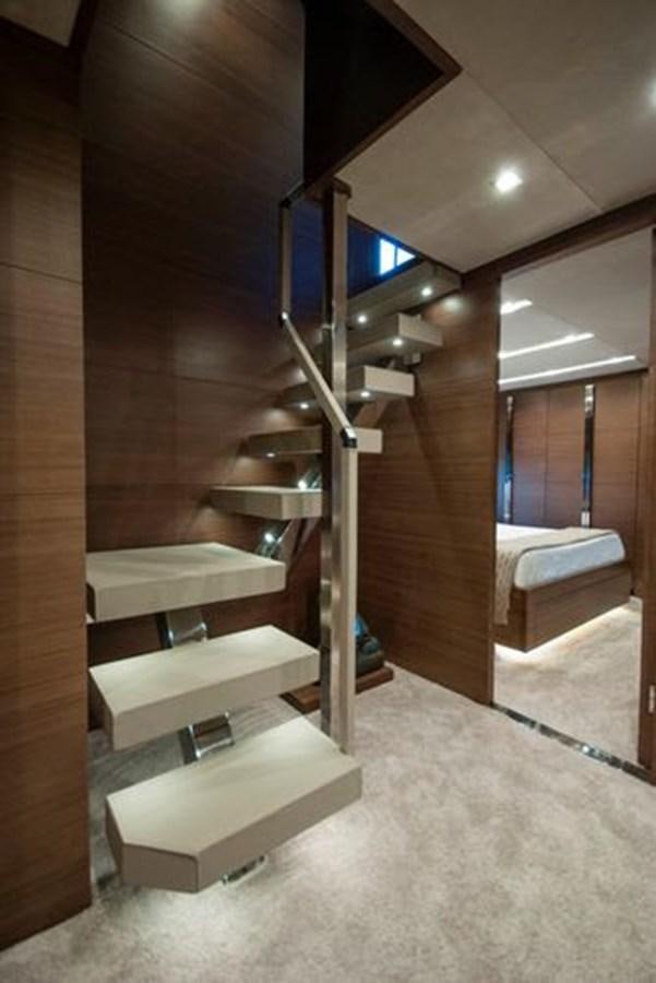 a wooden staircase with a large window aboard 2024 MCP 106 LE Yacht for Sale