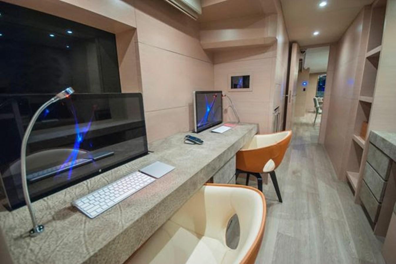 a room with a desk and computer aboard 2024 MCP 106 LE Yacht for Sale