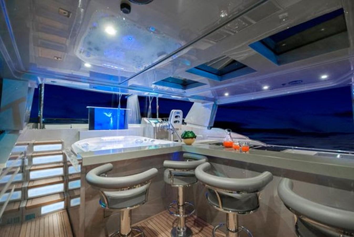 a room with tables and chairs aboard 2024 MCP 106 LE Yacht for Sale