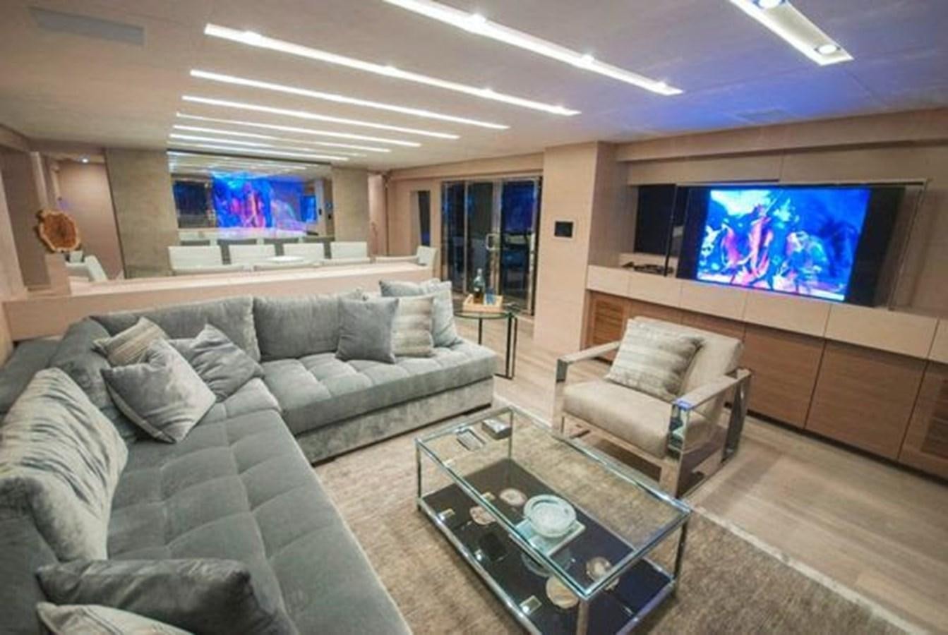 a living room with a large television aboard 2024 MCP 106 LE Yacht for Sale