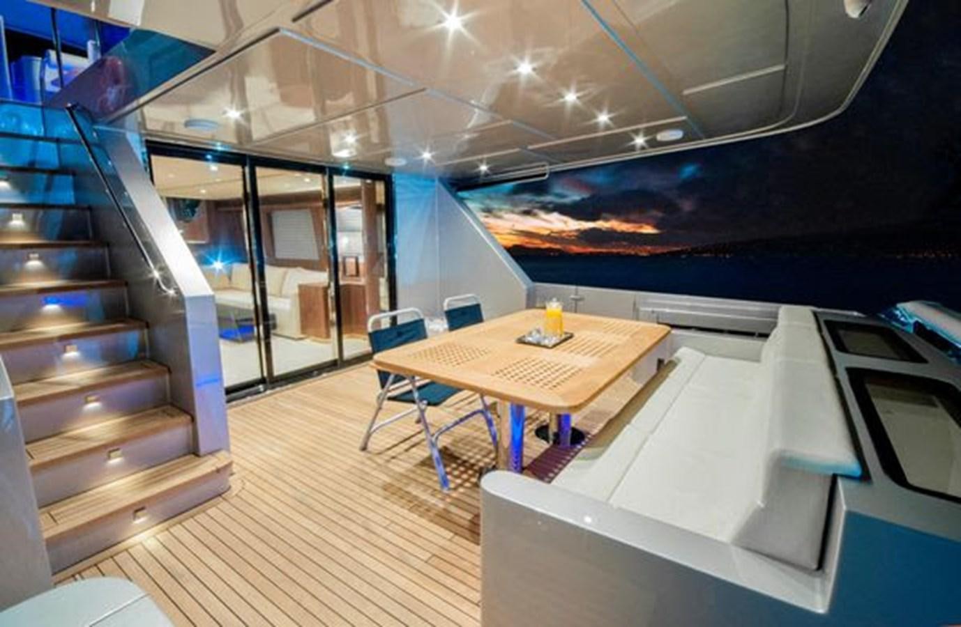 a room with a table and chairs aboard 2024 MCP 76 MY Yacht for Sale