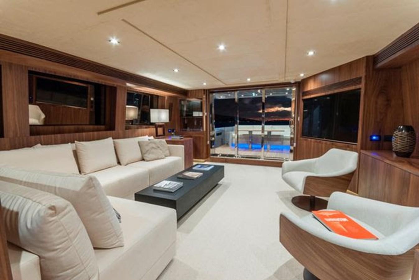 a living room with a large glass window aboard 2024 MCP 76 MY Yacht for Sale