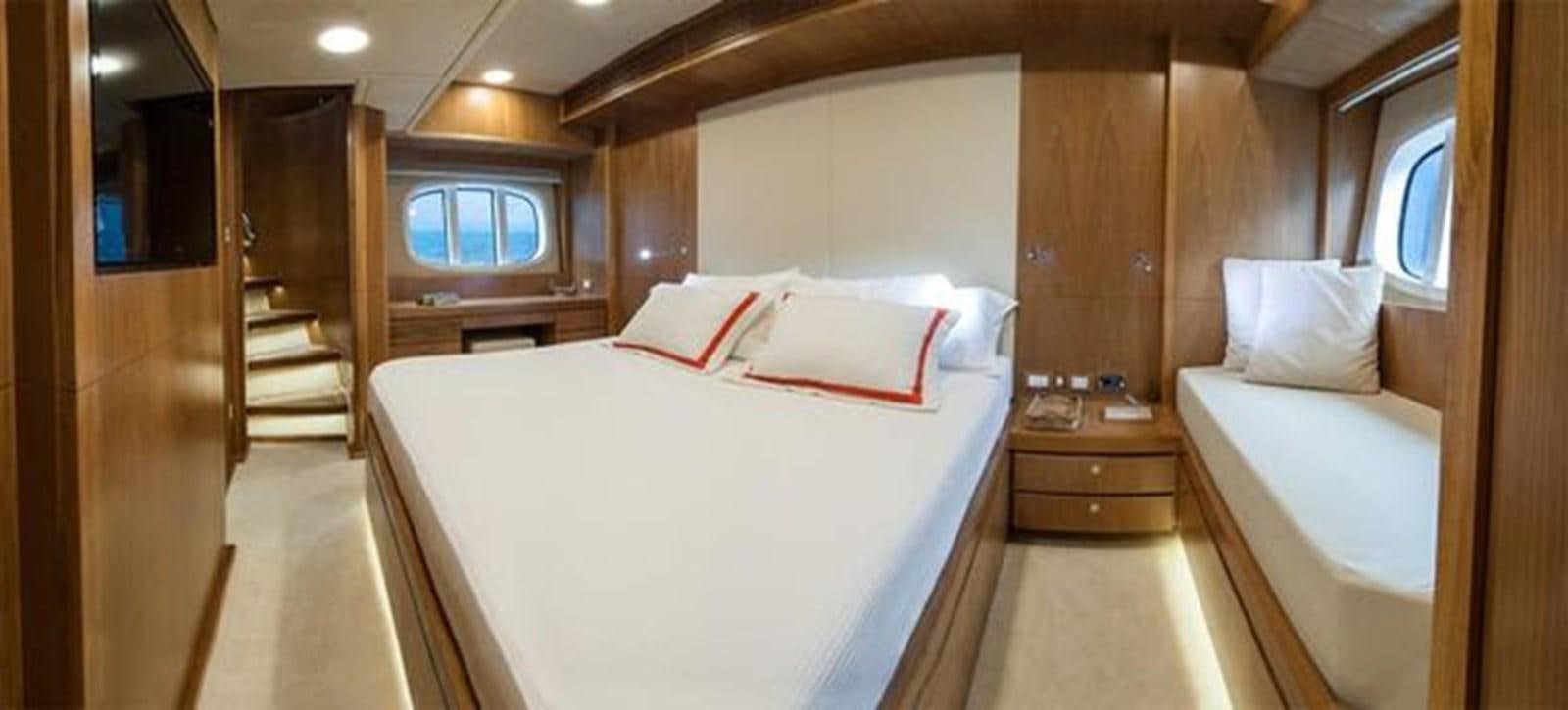 a room with a bed and a staircase aboard 2024 MCP 76 MY Yacht for Sale