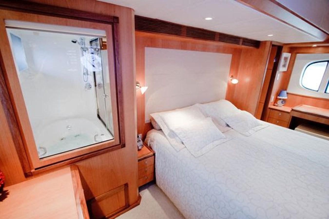 a room with a bed and a window aboard 2024 MCP 76 MY Yacht for Sale