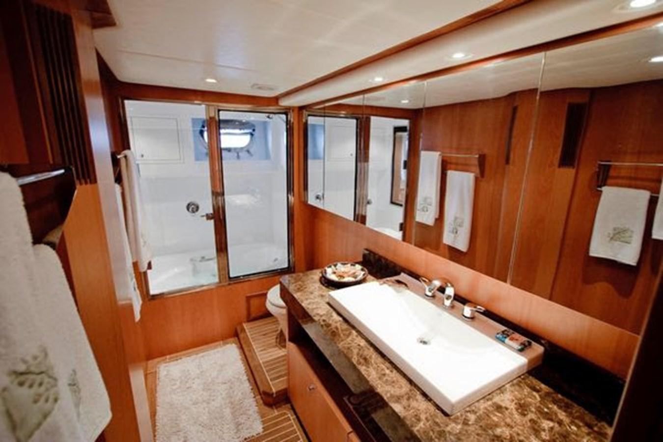 a bathroom with a sink and a mirror aboard 2024 MCP 76 MY Yacht for Sale