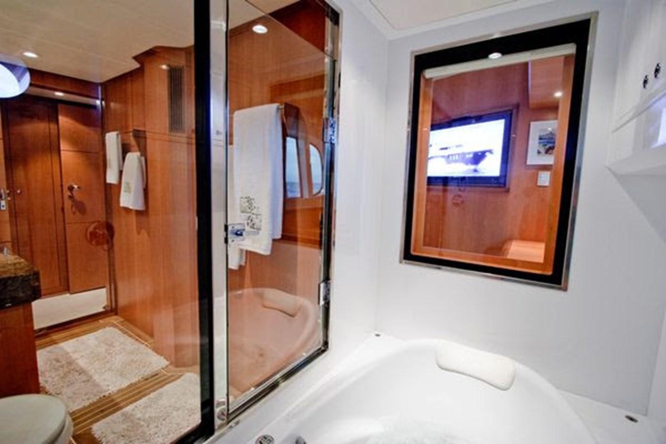 a bathroom with a glass shower aboard 2024 MCP 76 MY Yacht for Sale