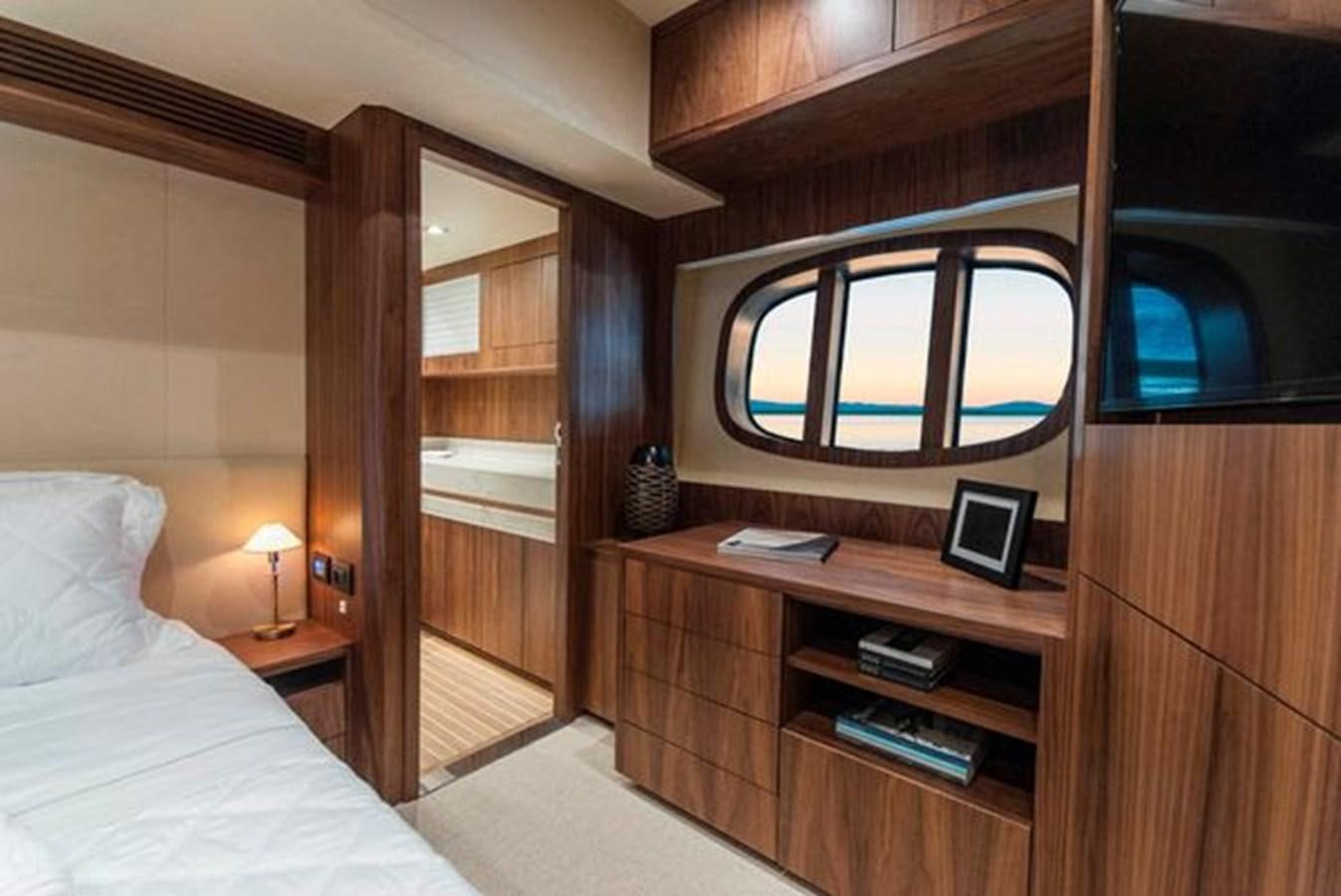 a room with a bed and a window aboard 2024 MCP 76 MY Yacht for Sale