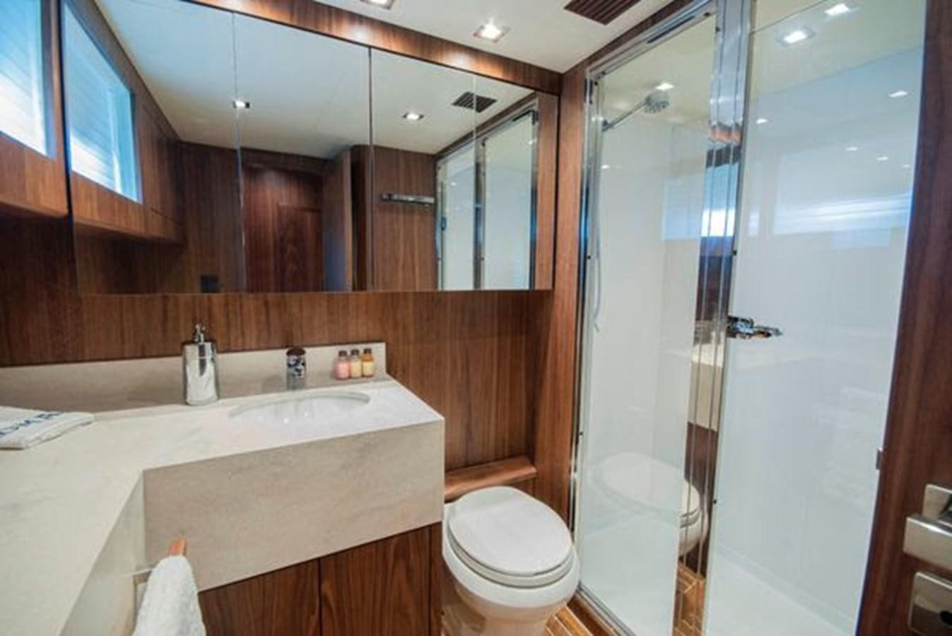 a bathroom with a glass shower aboard 2024 MCP 76 MY Yacht for Sale