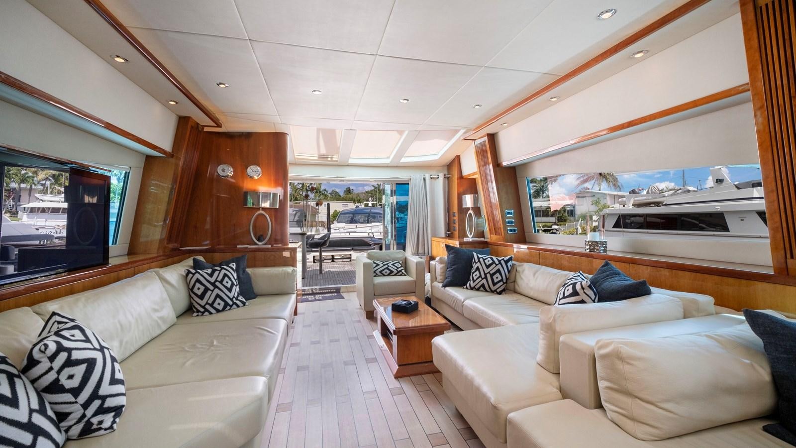 a living room with a large window aboard GBXSK04137L607 Yacht for Sale