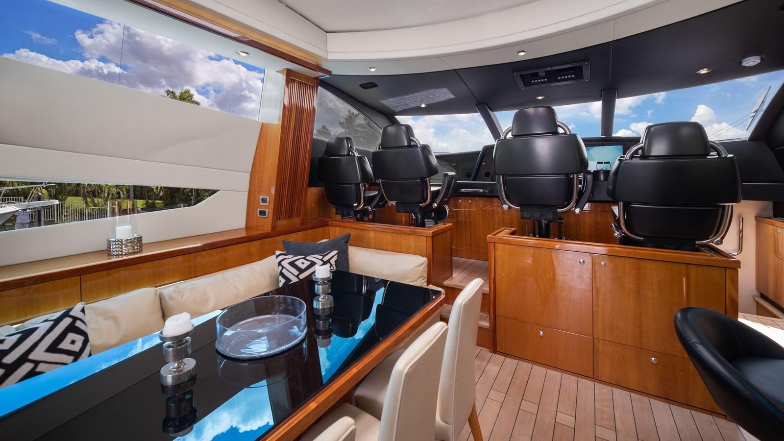 inside of a vehicle with a table and chairs and a large window aboard GBXSK04137L607 Yacht for Sale