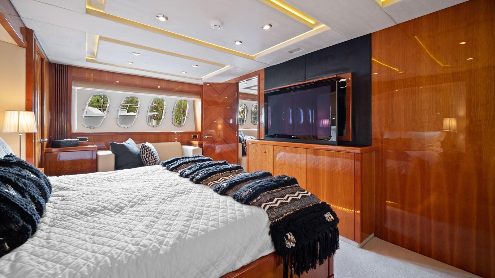 a bedroom with a bed and a television aboard GBXSK04137L607 Yacht for Sale