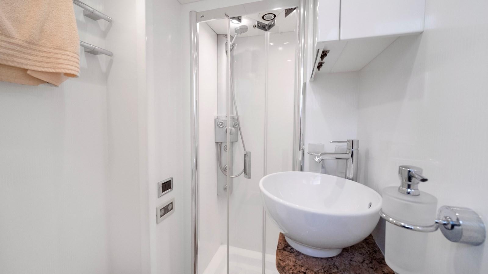 a bathroom with a shower and sink aboard GBXSK04137L607 Yacht for Sale
