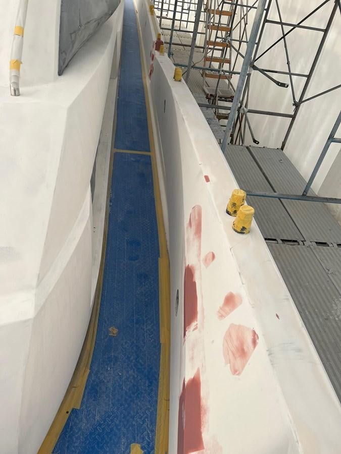 a blue surfboard with a yellow toy on it aboard GBXSK04137L607 Yacht for Sale