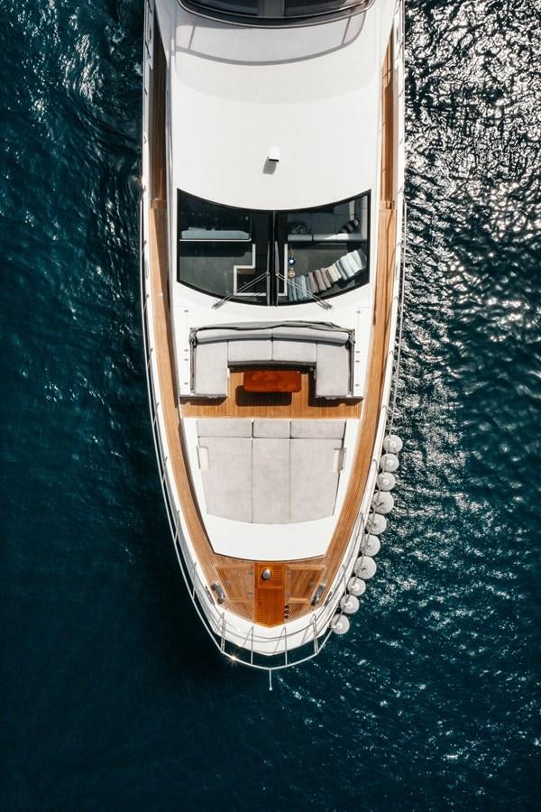 a white boat in a body of water aboard AZIMUT 88 DELETE Yacht for Sale