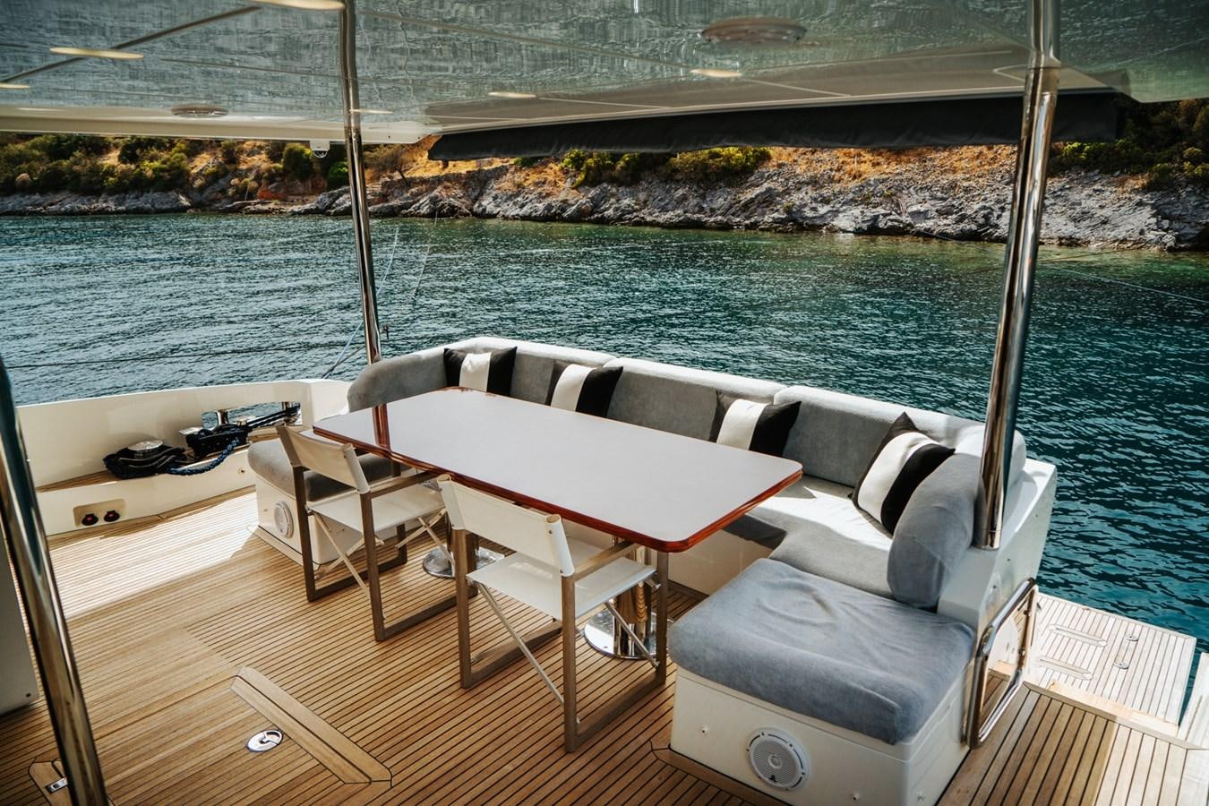 a deck with a couch and a pool aboard AZIMUT 88 DELETE Yacht for Sale