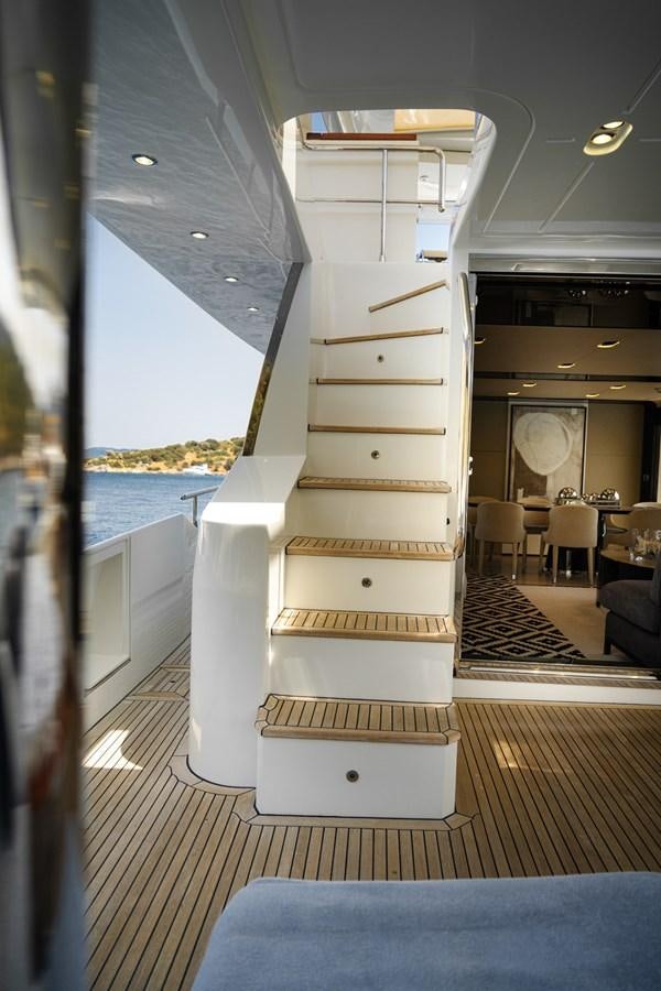 a staircase with a wood railing aboard AZIMUT 88 DELETE Yacht for Sale