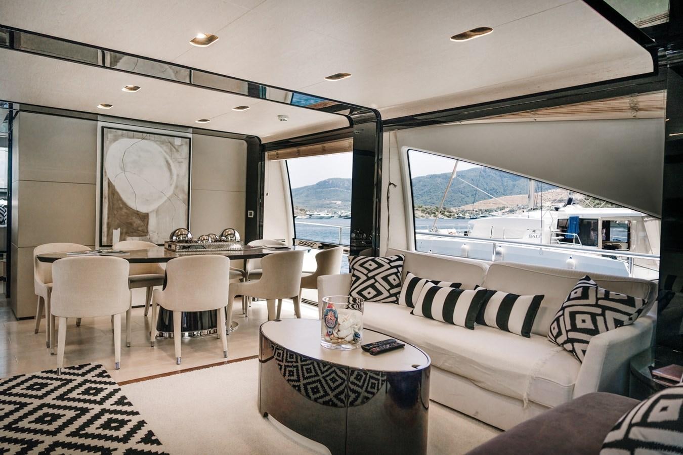 a living room with a large window aboard AZIMUT 88 DELETE Yacht for Sale