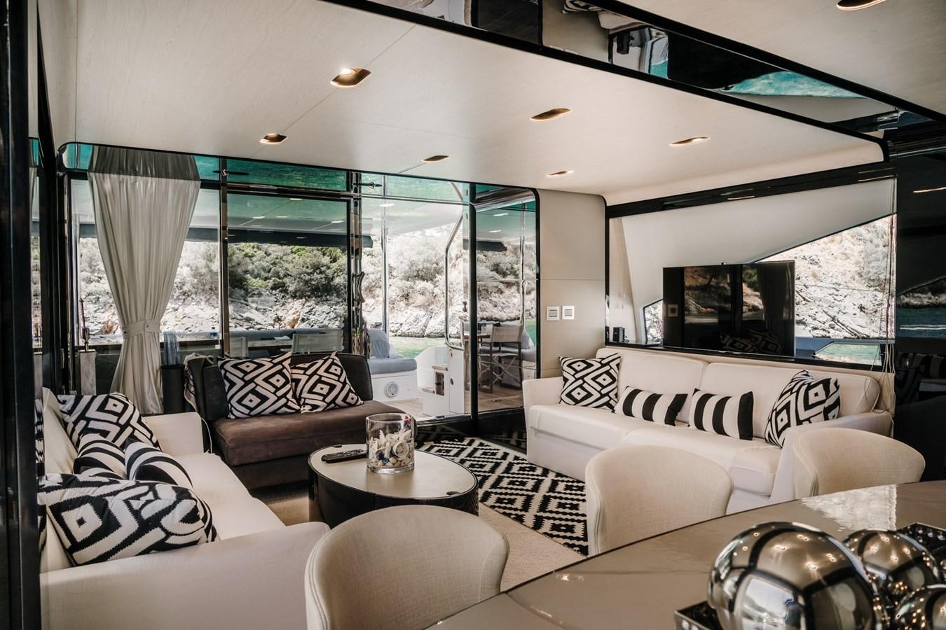 a living room with a large window aboard AZIMUT 88 DELETE Yacht for Sale